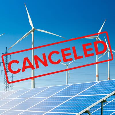 A canceled stamp superimposed over a wind and solar farm