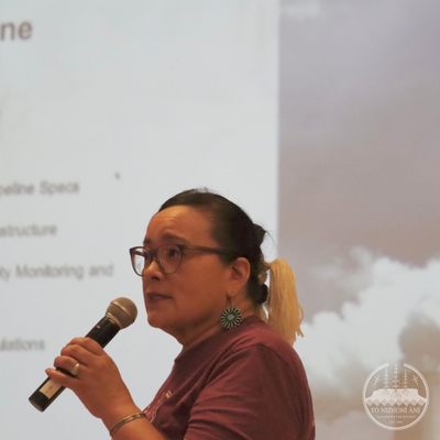 Eleanor Smith speaking into a microphone