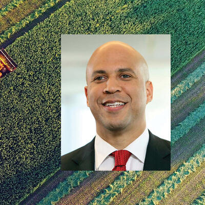 Cory Booker in green farm 