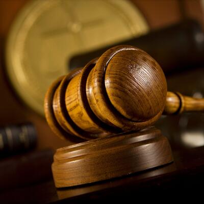 A gavel rests on a judge's desk