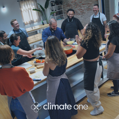 people gathered around a kitchen island cookstove